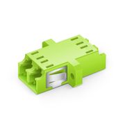 This picture is about The picture shows that the cyan OM5 adapter is lying flat and inclined 45. You can see that it has a flange and a stainless steel buckle, and the dust cap is white..